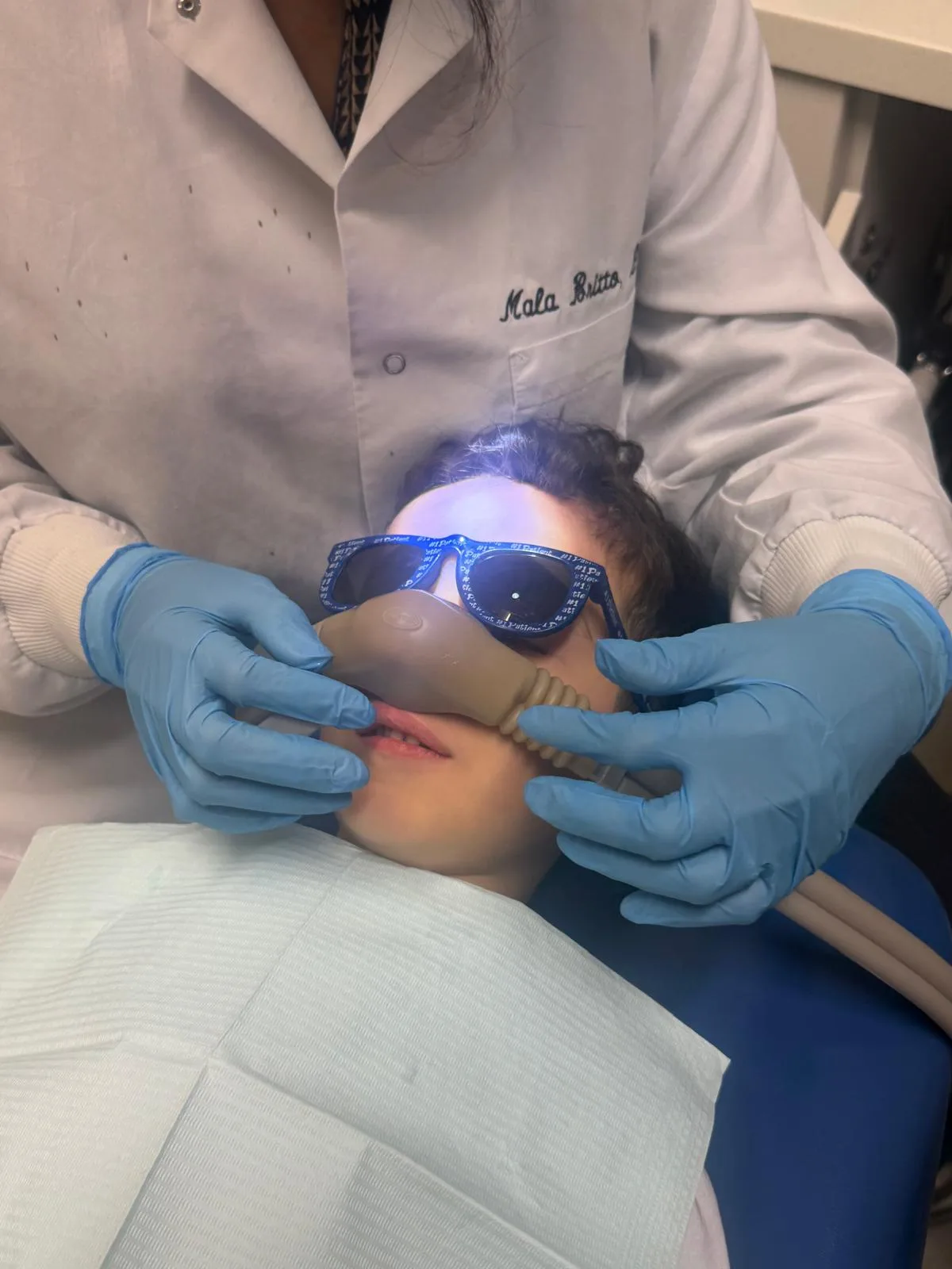 Nitrous oxide keeping a child relaxed and comfortable during a dental procedure