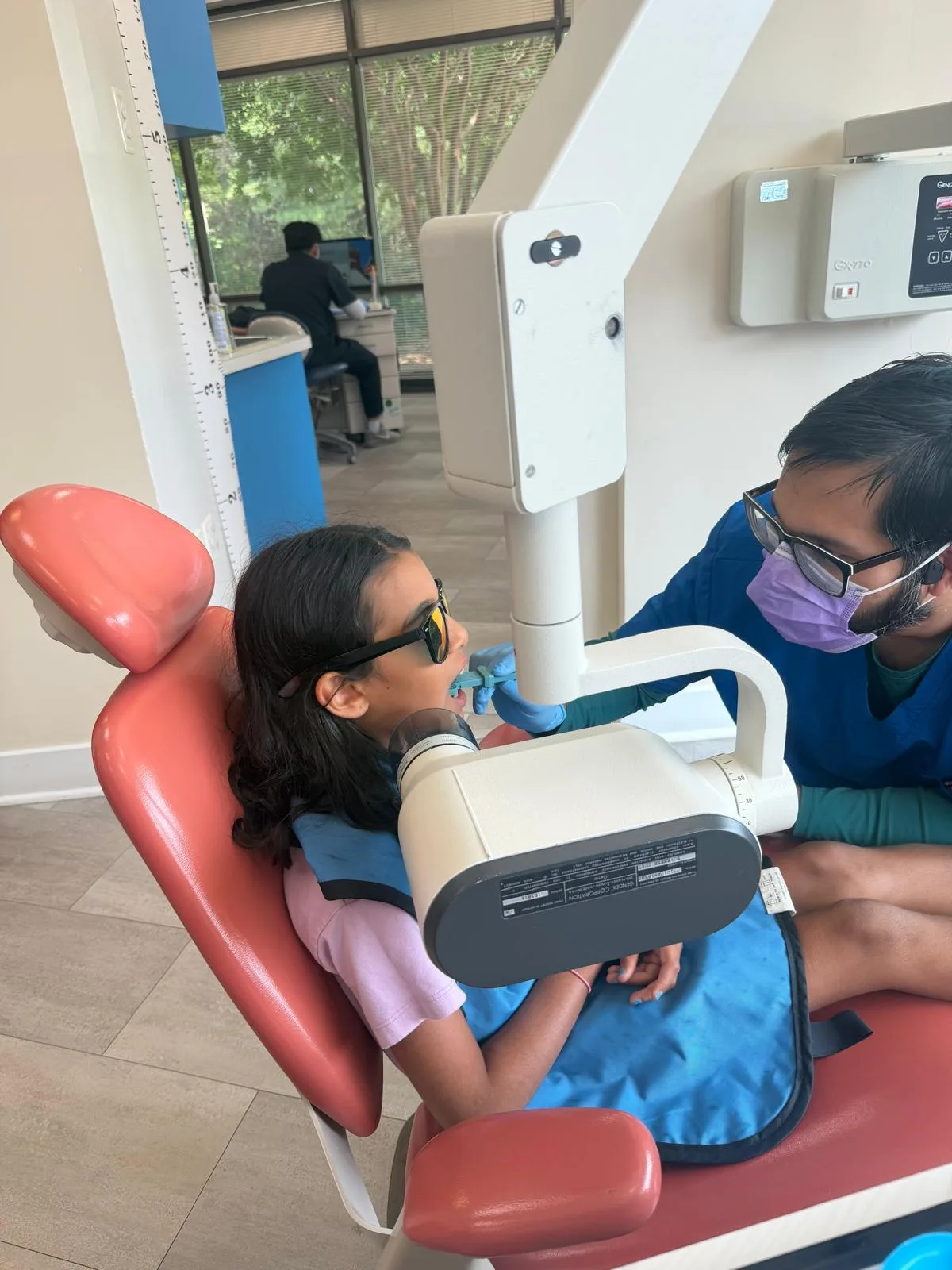 Child having digital dental x-rays taken at Britto Children Dentistry